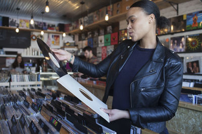 Young woman in a record store.