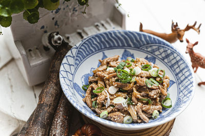 High angle view of stir-fried pork shreds in bowl on table