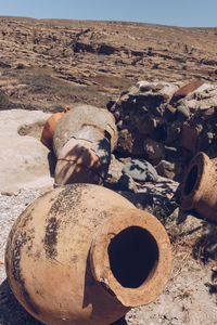 Old earthenware containers on land