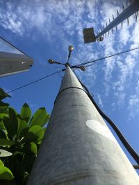 Low angle view of pole against blue sky