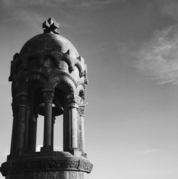 Low angle view of column against sky