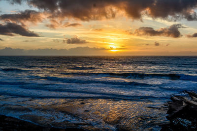 Scenic view of sea against sky during sunset
