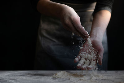 Midsection of person preparing food on table