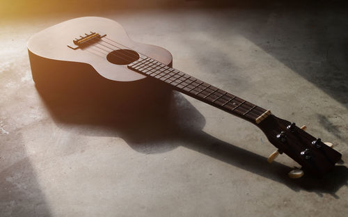 High angle view of guitar on floor