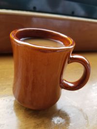 Close-up of coffee cup on table