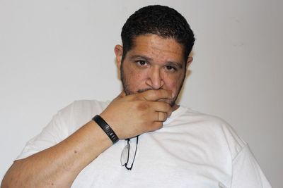 Close-up portrait of mid adult man over white background