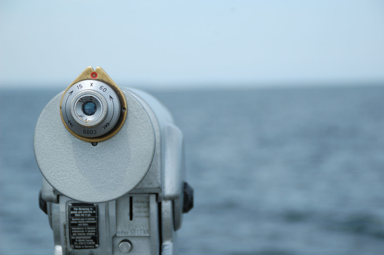 close-up, focus on foreground, copy space, part of, day, no people, metal, cropped, clear sky, sea, water, coin-operated binoculars, outdoors, selective focus, built structure, white color, nature, single object, sky, old