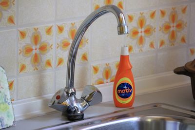 Close-up of faucet in bathroom at home