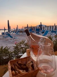 Panoramic shot of water on table against sea during sunset