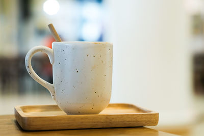 Close-up of coffee cup on table