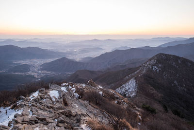 Scenic view of mountains against sky during sunset