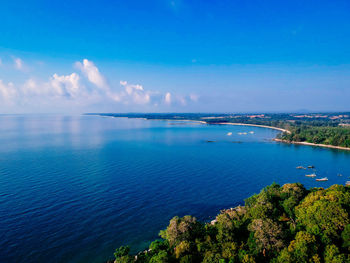 High angle view of bay against blue sky