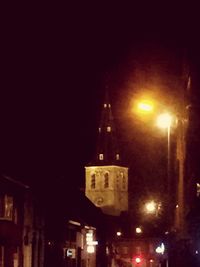 Low angle view of illuminated building at night