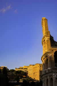 Colosseum at sunset - oval roman amphitheatre ruins - rome, italy