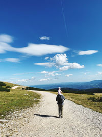 Full length of woman on mountain against sky