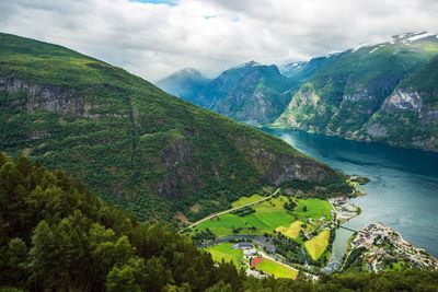 Scenic view of mountain against cloudy sky