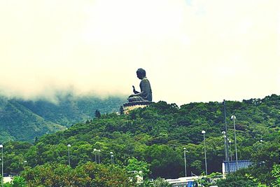 View of people standing on mountain