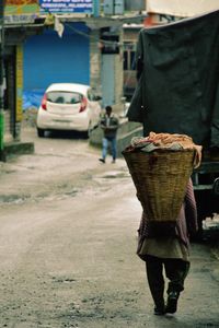 Woman standing on city street