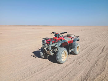 A group of people on quad bikes in the desert of egypt