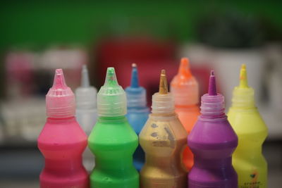 Close-up of multi colored bottles