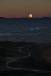 Scenic view of landscape against sky at night