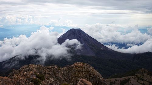 Panoramic view of volcanic mountain range against sky