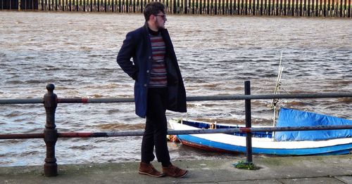 Full length of woman standing in water