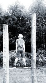 Rear view of woman standing in park