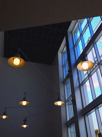 Low angle view of hanging lights hanging from ceiling