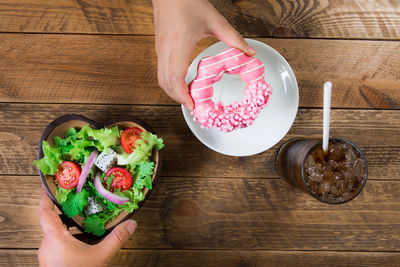 High angle view of woman preparing food on table