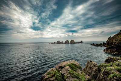 Scenic view of sea against cloudy sky