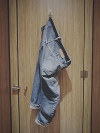 Jeans hanging on closed door