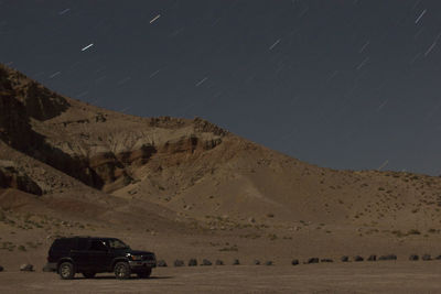 Scenic view of desert against sky at night