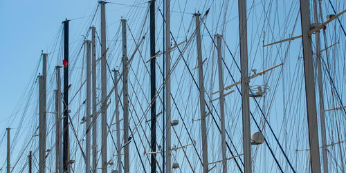 Ship mast in the port of bodrum, turkey in front of cloudless sky