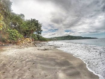 Scenic view of beach against sky