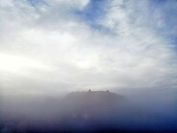 Low angle view of fog against sky