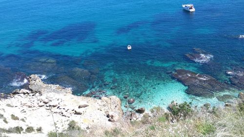 High angle view of rocks in sea