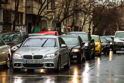 Cars on wet street in rainy season