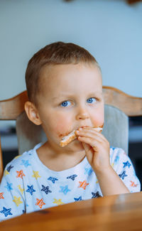 Portrait of cute girl eating food