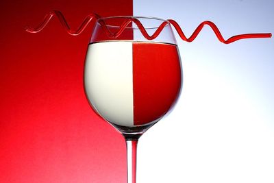 Close-up of red object over white background