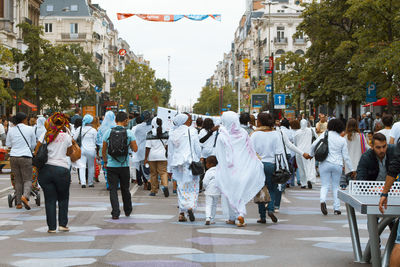 People on road in city