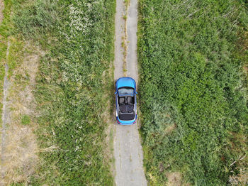 High angle view of arrow sign on field