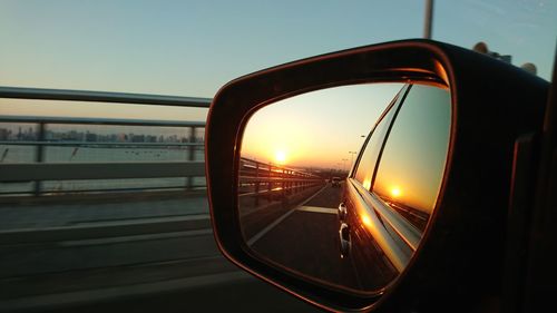 Reflection of sky on side-view mirror