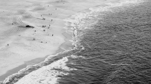 High angle view of tire tracks on beach