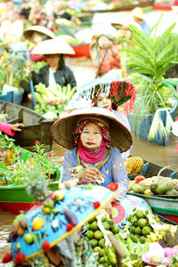 Portrait of woman in market stall