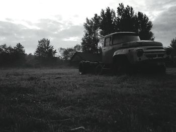 View of agricultural vehicle on landscape against sky