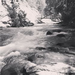 Scenic view of river flowing during winter