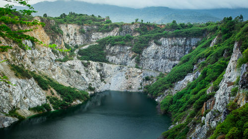 High angle view of river amidst mountains