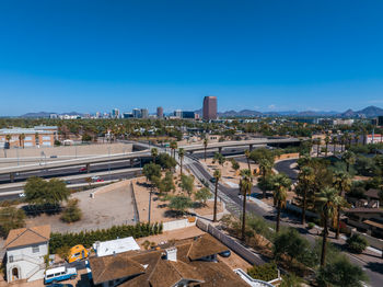 High angle view of townscape against clear blue sky