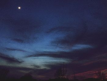 Low angle view of dramatic sky at night